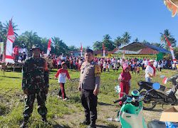 Bhabinkamtibmas Polsek Sarudu Bersama Babinsa Amankan Lomba HUT Kemerdekaan RI ke 79 Di Desa Bulumario