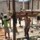 Kebersamaan Tanpa Sekat, Bhabinkamtibmas Polsek Baras Gotong Royong Bantu Bangun Rumah Warga