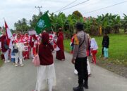 Sukseskan HUT RI ke-80, Polsek Pasangkayu Kawal Lomba Gerak Jalan di Tikke