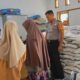 Bhabinkamtibmas Polsek Bambalamotu Kawal Penyaluran Bantuan Pangan 2026, Ratusan Warga Desa Kalola Terima Beras dan Minyak