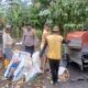 Bhabinkamtibmas Polsek Bambalamotu Panen Jagung Kelompok Tani di Desa Bambaira