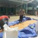 Bhabinkamtibmas Polsek Mambi Pantau Penjemuran Jagung Warga di Dusun Sikki-sikki, Desa Rantebulahan