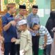 Kanit Bhabinkamtibmas Polres Majene Hadiri Peringatan 10 Muharram Bersama Pemerintah Daerah, Gaungkan Semangat Berbagi dan Kepedulian